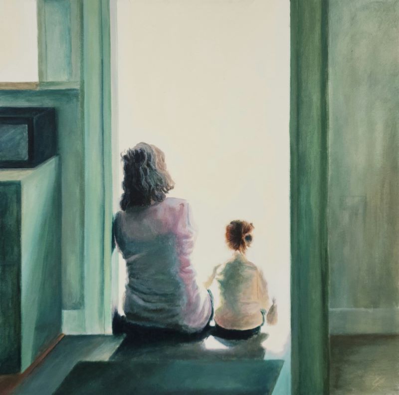 Grandmother and grandchild sitting in a doorway